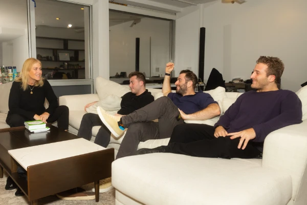 Tammy Cohen and her sons on the couch talking